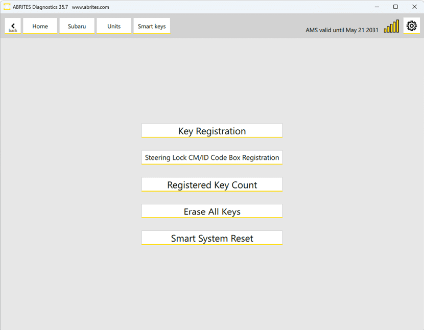 A digital interface screen displays options for key registration including steering lock code box registration, registered key count, erase all keys, and smart system reset. Description generated by AI